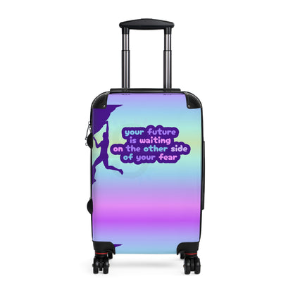 Suitcase with motivational quote "Your future is waiting on the other side of your fear"